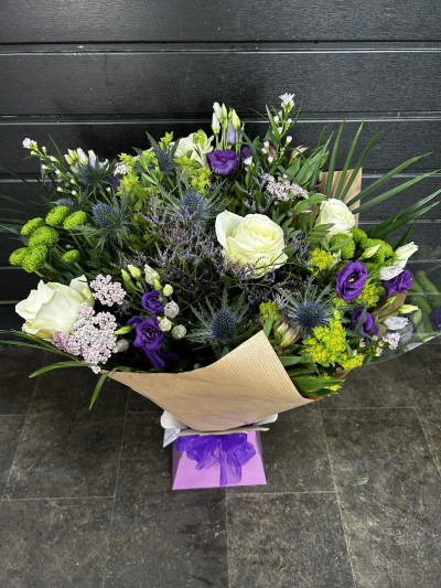 Cool Breeze - This classical stylish collection of flowers, make this hand tied the perfect gift. Flowers professionally arranged and delivered by a local florist.