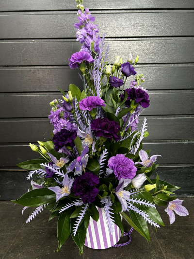 Pot of Happiness - A small but choice selection of flowers arranged in a petite container.