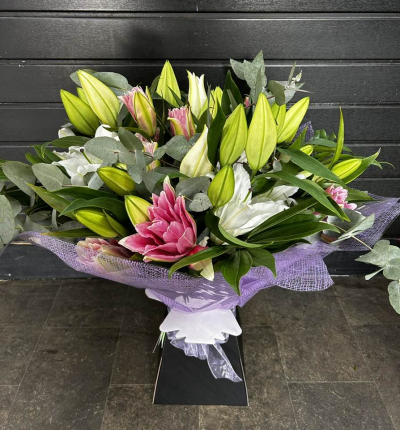 Forever Yours - Show your affection with this fabulous hand-tied  featuring white oriental lilies and foliage.