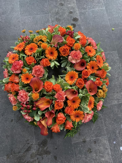 Wreath SYM-317 - A classic wreath arranged using mixed flowers.