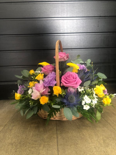 Sherbet Twist - This delightful collection of seasonal blooms is a beautiful way to send your affections. A pretty arrangement in a classic basket simply fizzing with joy and character.