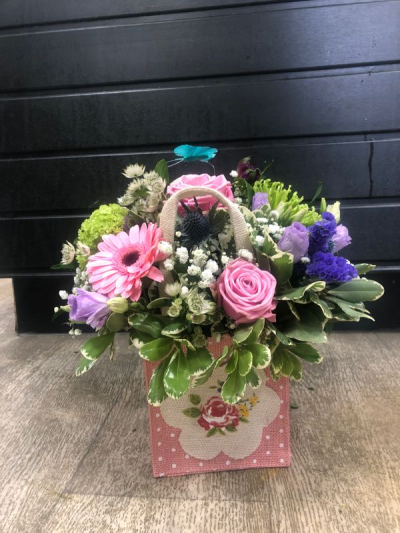 A Little Something - Show your affection with this mouth-watering mix of classical flowers delivered in a delightful gift bag or box.