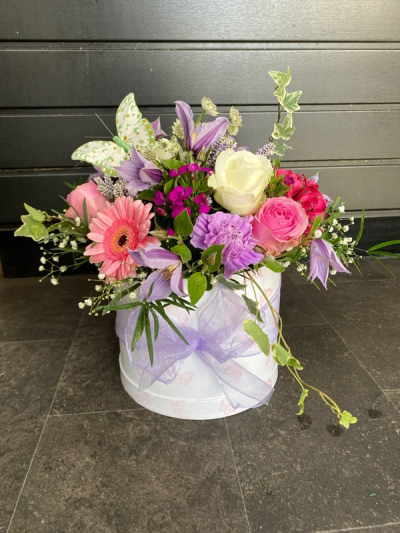 Secret Whispers - This luxury arrangement of flowers in a stylish Hat Box will be remembered for a long time!