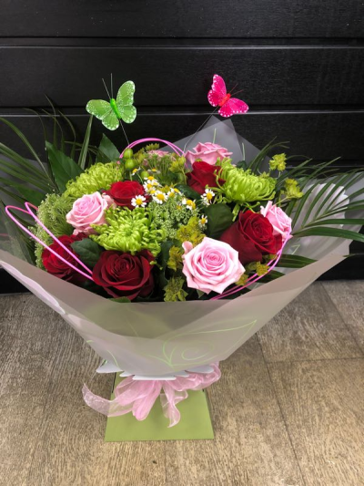 Butterflies & Roses - Beautiful hand-tied of mixed roses arranged in Oasis with choice filler and foliage with a novelty item presented in a gift box or bag.